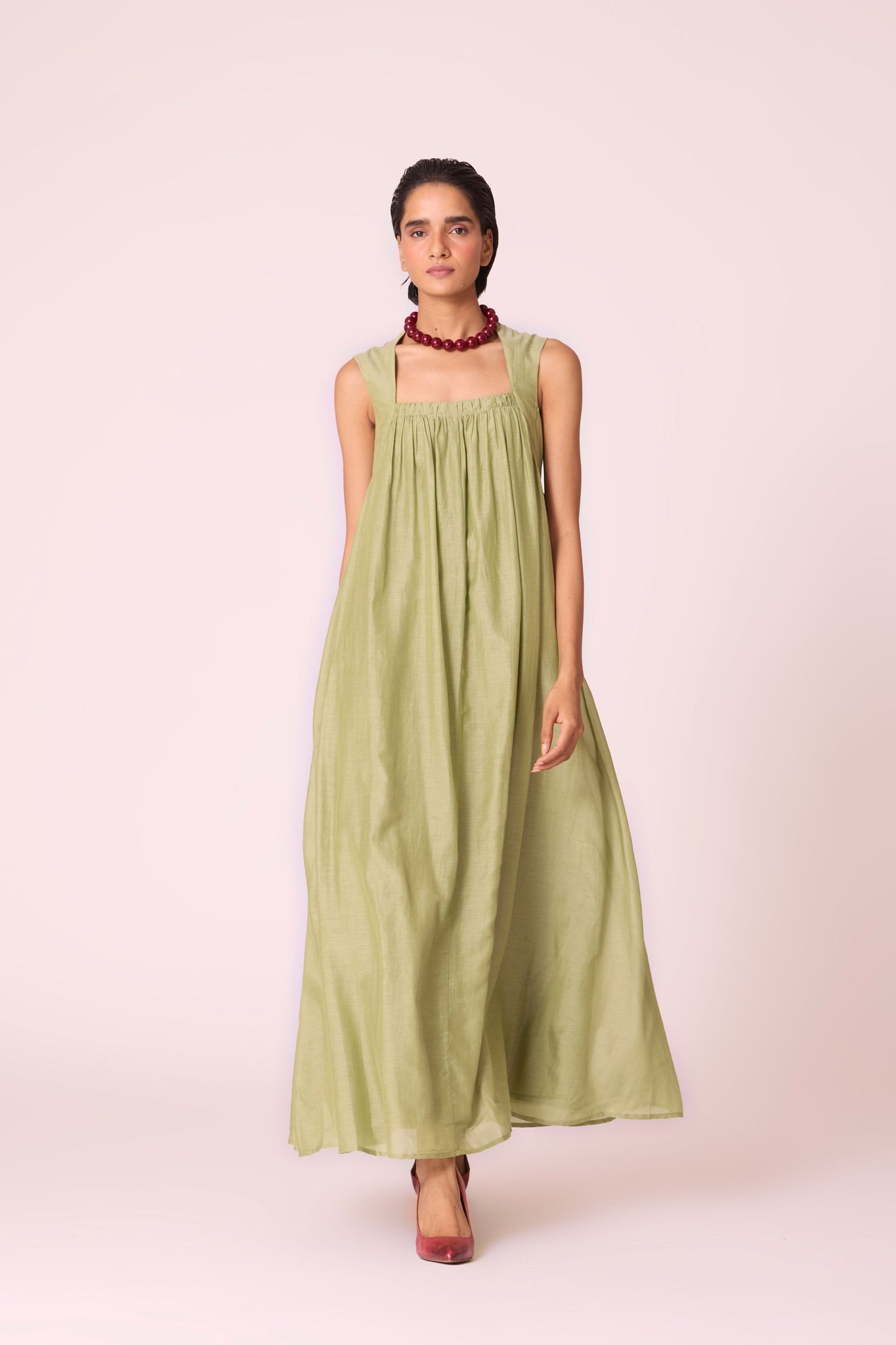 Green silk-cotton maxi dress with square neckline, full lining, in-seam pockets, and concealed side zip.