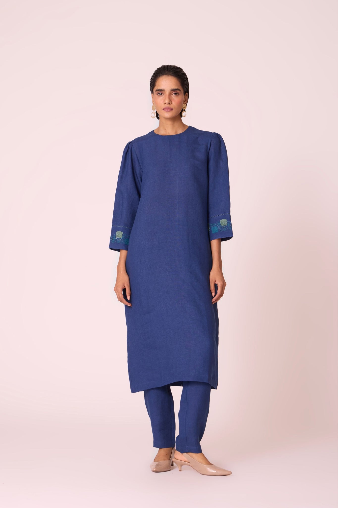 Ink blue linen tunic set with hand-embroidered 3/4 sleeves, back button tunic, and slim-fit side-zip pants.