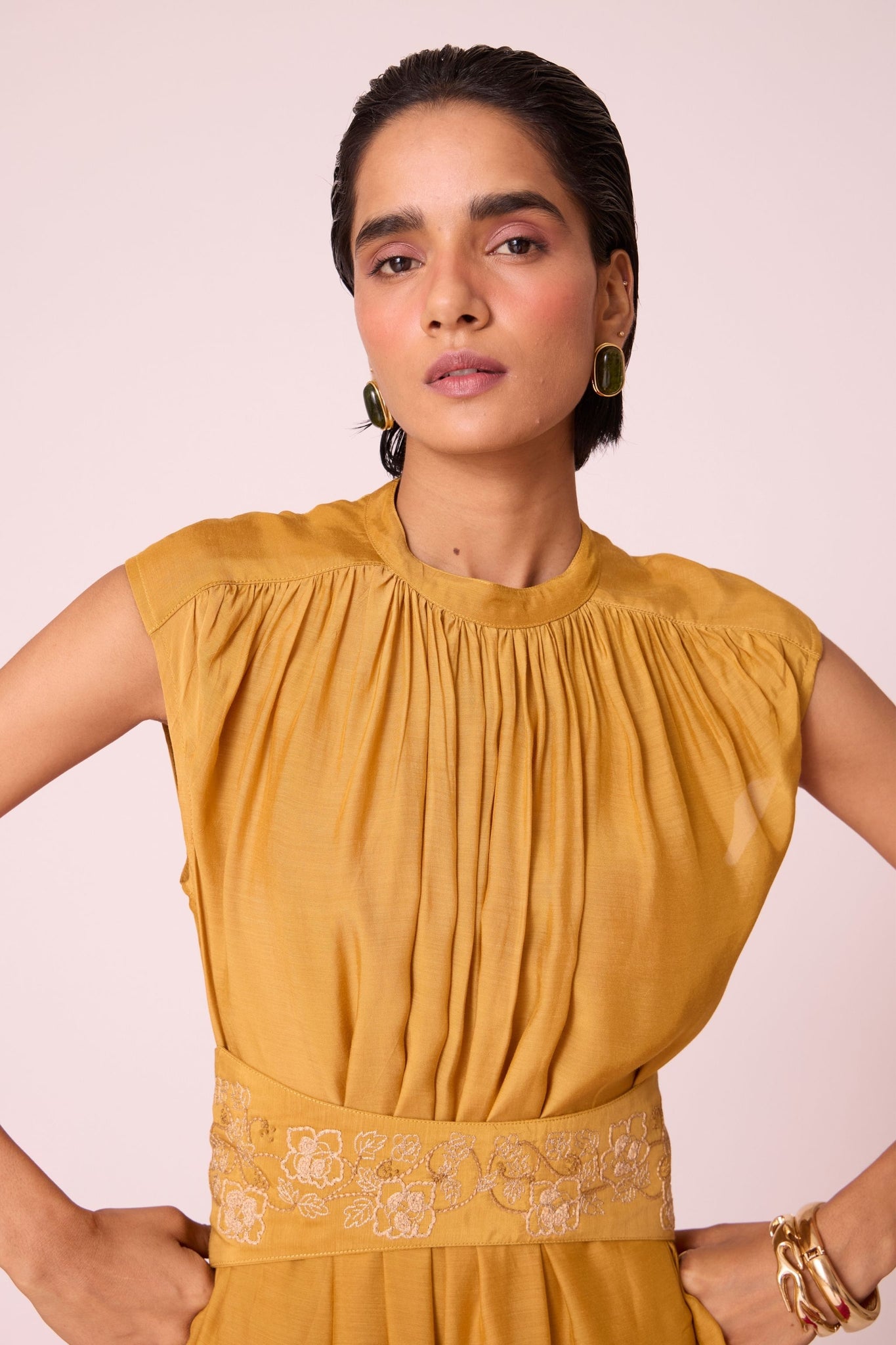 Yellow cupro midi dress with adjustable hand-embroidered belt, back button fastening, and slip included.
