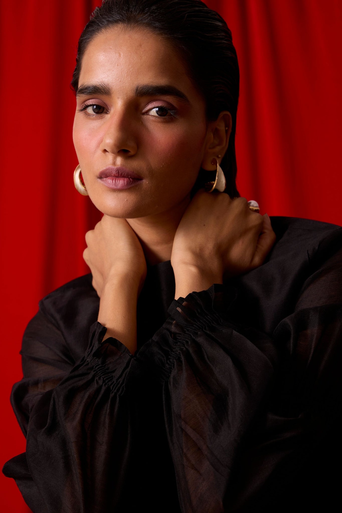 Black handwoven Chanderi top with drawstring waist, back button fastening, and elasticated sleeve details.