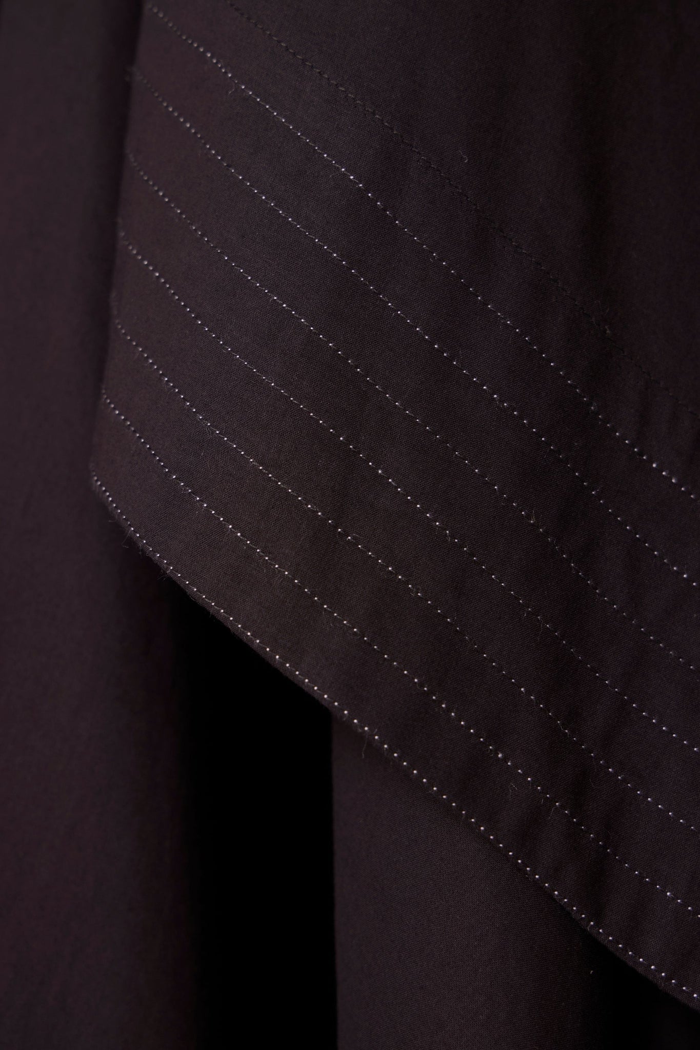 Black layered maxi dress in organic cotton cambric with in-cut shoulders and rouleau back fastening.
